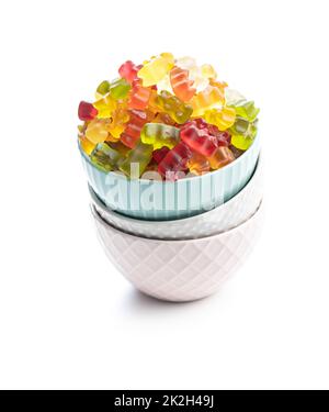 Jelly gummy bears candy in bowl. Colorful sweet confectionery isolated on white baackground. Stock Photo