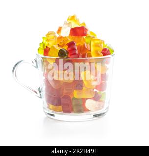 Jelly gummy bears candy in cup. Colorful sweet confectionery isolated on white baackground. Stock Photo