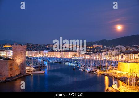 Marseille Old Port and Fort Saint-Jean in night. Marseille, France Stock Photo