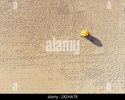 Izmir, Turkey - August 17, 2022: Aerial top view of the Ilica beach sand in summer Cesme Izmir Turkey there is one umbrella on the beach Stock Photo