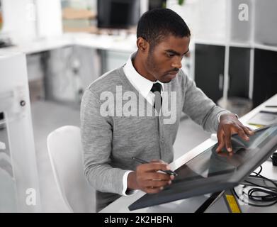 Smart technology makes everything easier. A young man working on a large touchscreen. Stock Photo