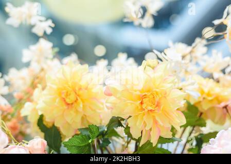 Yellow artificial flowers bouquet decorating shopping mall Stock Photo