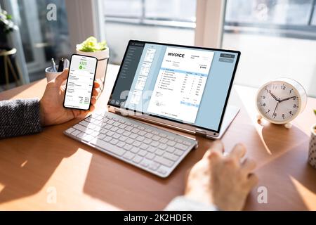 Accountant Checking Online Invoice Stock Photo