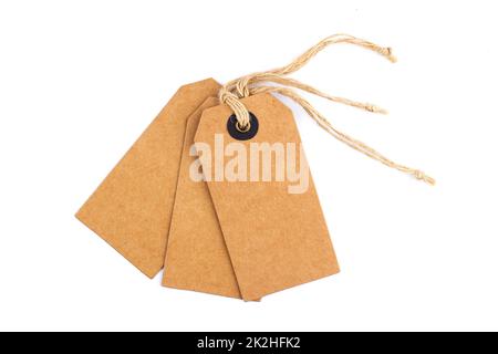 craft paper blank tags mockup with textile thread isolated on white background Stock Photo