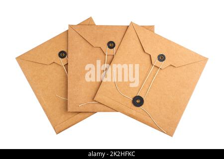 square craft paper envelopes with textile thread enclosing isolated on white Stock Photo
