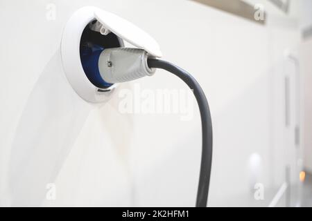 closeup of motorhome electricity outlet attached to white RV campervan Stock Photo