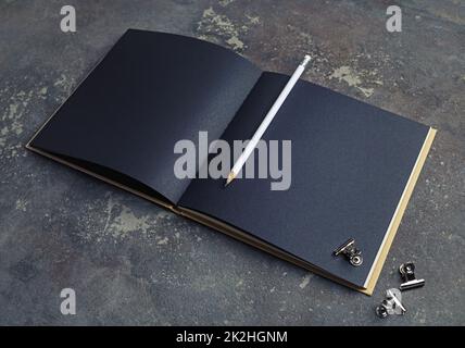 Black sketchbook, pencil, clips Stock Photo
