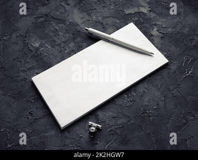 Envelope, pen, metal clip Stock Photo