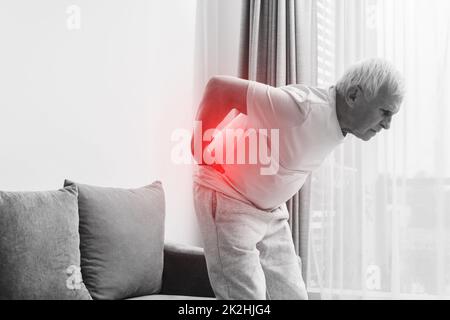 Senior man is suffering from pain in lower back Stock Photo