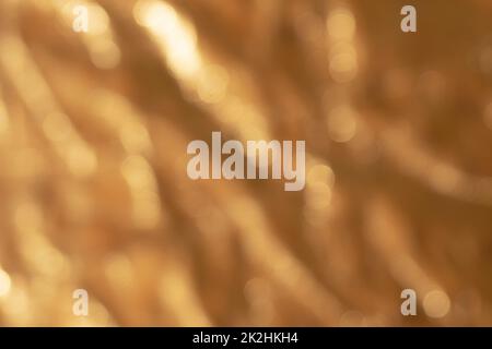 Out of focus golden metallic background Stock Photo