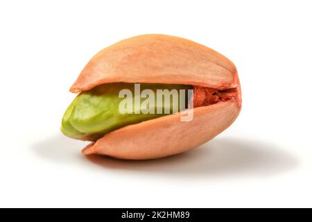 Single pistachio shell, with peeled green shell inside, isolated on white background. Stock Photo