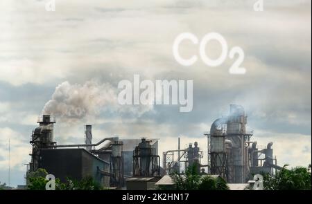 CO2 emissions. CO2 greenhouse gas emissions from factory chimneys. Carbon dioxide gas global air climate pollution. Carbon dioxide in earths atmosphere. Greenhouse gas. Smoke emissions from chimneys. Stock Photo