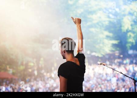 Enjoying the music festival. Cropped shot of a large crowd at a music concert. Stock Photo