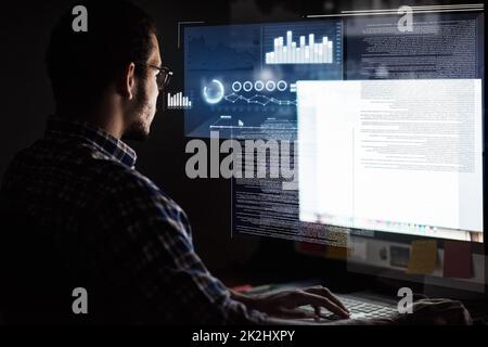 Encoding in progress. Cropped shot of a young computer programmer looking through data. Stock Photo