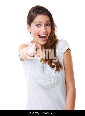 You're funny. A beautiful young woman pointing her finger at the camera in a teasing gesture. Stock Photo