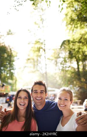 His favorite friends. A group of friends standing together in an outdoor environment. Stock Photo