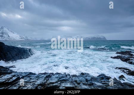 Norwegian Sea waves on rocky coast of Lofoten islands, Norway Stock Photo