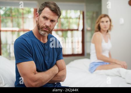 I dont want to talk about this. Shot of a mature couple having marital problems in the bedroom at home. Stock Photo