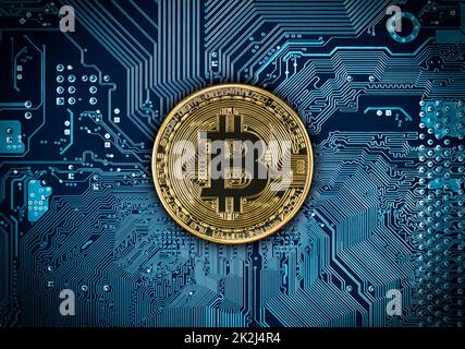 Bitcoins coins on blue circuit board Stock Photo