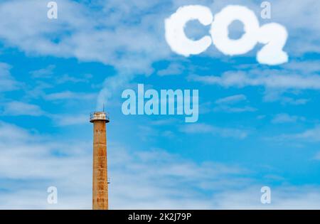 CO2 emissions. CO2 greenhouse gas emissions from factory chimney. Carbon dioxide gas global air climate pollution. Carbon dioxide in earths atmosphere. Greenhouse gas. Smoke emissions from chimney. Stock Photo