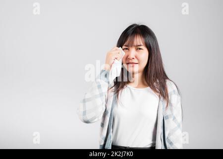 Unhappy woman bad mood her cry wipe mucus with tissue Stock Photo