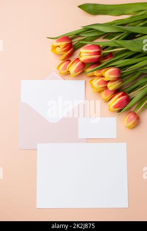 Blank Clean minimal business card mockup and elegant greeting card with bouquet of tulips Stock Photo
