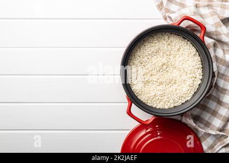 Uncooked Carnaroli risotto rice in pot. Stock Photo