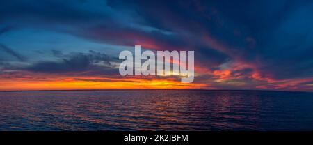 Beautiful sunset over the water surface Stock Photo