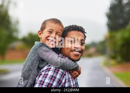 Im so lucky to have the best Dad ever. Portrait of a father and son enjoying a day outside together. Stock Photo