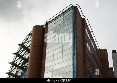 London, United Kingdom - November 25th, 2006: Architecture on modern east wing of St Thomas' Hospital (reconstructed in 1950s) with gray overcast sky in background. Stock Photo