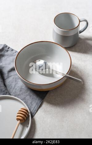 Empty plates on grey background Stock Photo