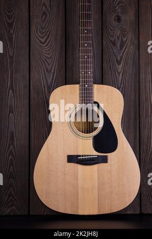 Classical acoustic guitar on wooden background Stock Photo