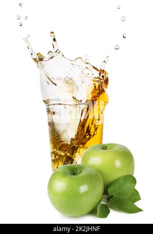 Glass of apple juice with splash and green apples Stock Photo