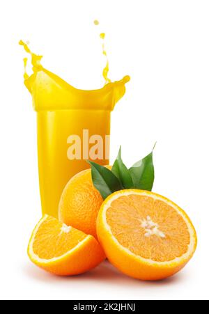 Glass of orange juice and oranges with leaves Stock Photo