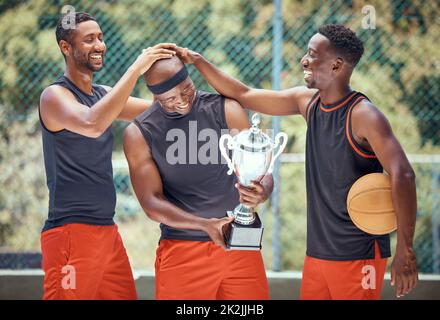 Basketball game, team sports and trophy winner in sport competition on court, collaboration for winning and teamwork for success in event. African Stock Photo