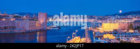 Marseille Old Port and Fort Saint-Jean in night. Marseille, France Stock Photo