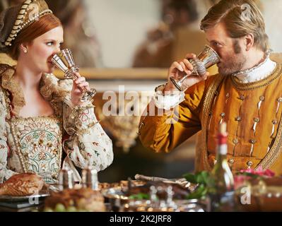 Where is our royal taster today. a noble couple eating together in the palace dining room. Stock Photo