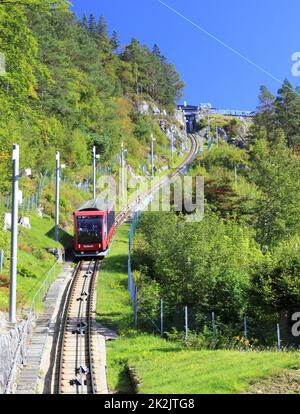 The Floibanen Funicular descends the tracks towards Bergen in Norway Stock Photo