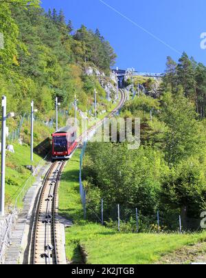 The Floibanen Funicular descends the tracks towards Bergen in Norway Stock Photo