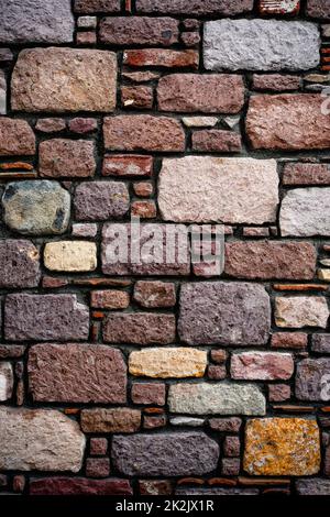 Vertical shot of stone tiles wall, background, texture, pattern. Stock Photo