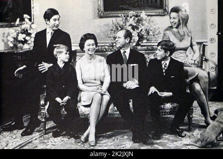 Photograph of Queen Elizabeth II (1926-) and the Duke of Edinburgh (1952-) with their children, Charles, Prince of Wales (1948-), Prince Edward (1964-), Prince Andrew (1960-) and Princess Anne (1950-). Dated 20th Century Stock Photo