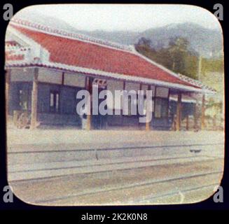 Railway station, Japan, 1895. Hand-coloured lantern slide Stock Photo