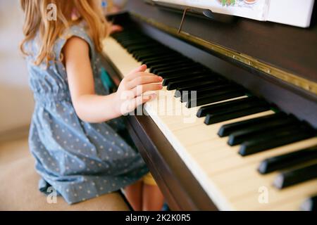 The next Mozart in the making. Cropped shot of a little girl playing the piano. Stock Photo