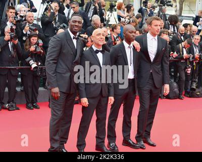 Crew of the film 'Tirailleurs' ('Father and Soldier'): Omar Sy, Mathieu Vadepied, Alassane Diong, Jonas Bloquet 'Top Gun: Maverick' Cannes Film Festival Screening 75th Cannes Film Festival May 18, 2022 Stock Photo