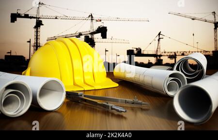 Construction blueprints, hardhat and tools on the table Stock Photo