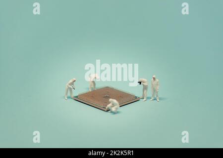 Technicians with CPU microprocessor. Stock Photo