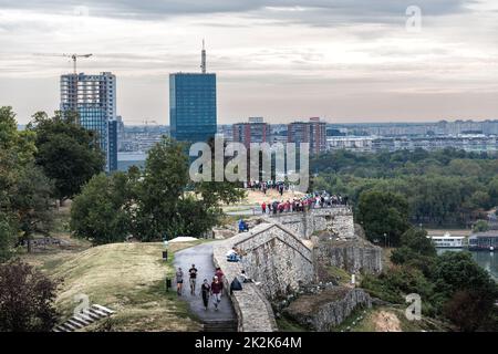 Belgrade, Serbia - September 25, 2019: People walking and resting on the wall promenade of Kalemegdan fortress Stock Photo