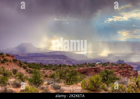 Storm clouds over Ekker Butte & the Orange Cliffs in the Glen Canyon NRA, viewed from the Candlestick Tower Overlook, Canyonlands NP, Utah. Stock Photo