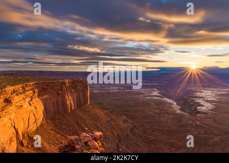 Sunrise over the La Sal Mountains and Buck Canyon in the Island in the Sky District, Canyonlands National Park, Utah.  Viewed from the Buck Canyon Ove Stock Photo