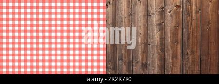 Tablecloth red and white on brown wooden planks Stock Photo